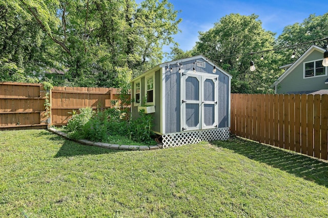 view of shed with a fenced backyard