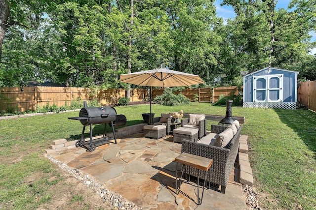 view of patio with an outbuilding, an outdoor hangout area, a shed, a fenced backyard, and a grill