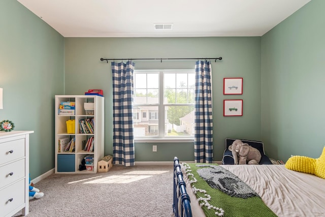 bedroom with carpet flooring, baseboards, and visible vents