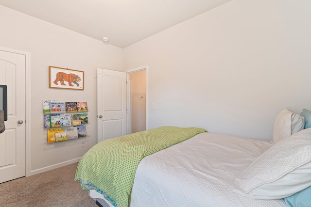 carpeted bedroom with baseboards
