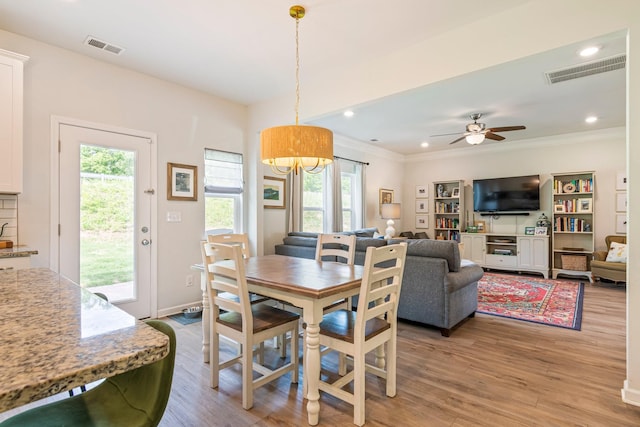 dining room featuring a wealth of natural light, light wood finished floors, and visible vents