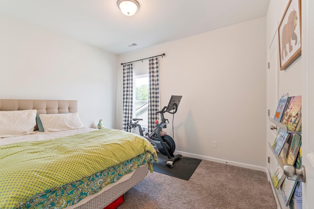 bedroom featuring baseboards, carpet flooring, and visible vents
