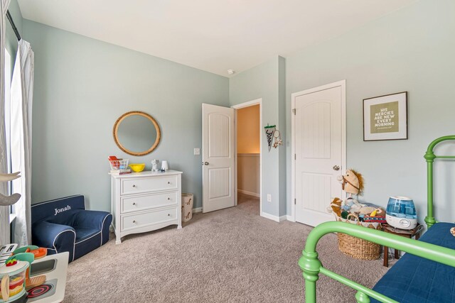 playroom featuring baseboards and carpet