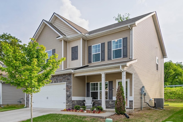 craftsman-style house featuring a garage, stone siding, central AC unit, a porch, and driveway