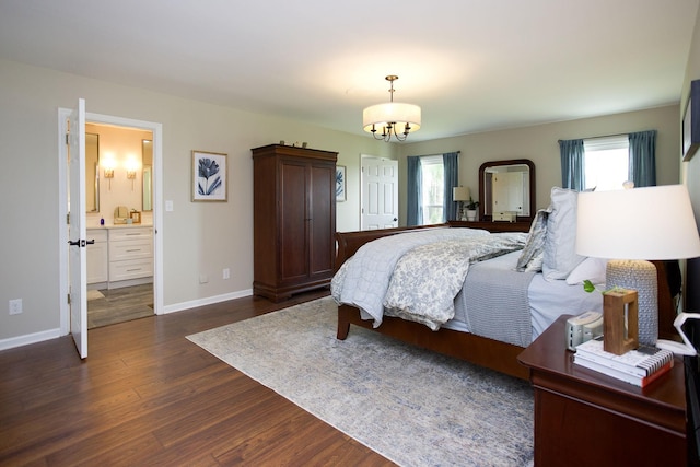 bedroom with dark wood-style flooring, baseboards, a chandelier, and ensuite bathroom