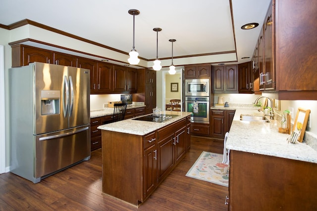 kitchen featuring crown molding, light stone countertops, appliances with stainless steel finishes, a sink, and a center island with sink