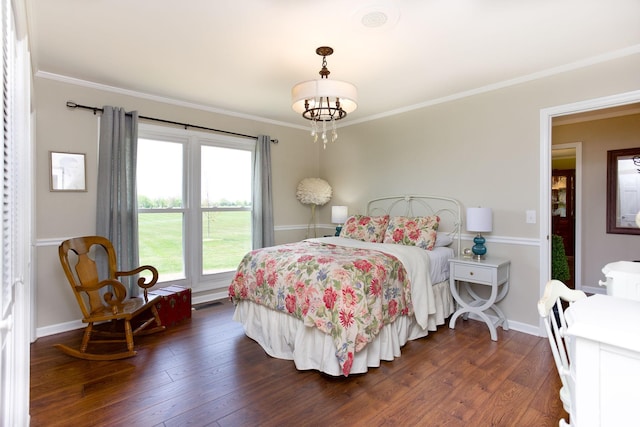 bedroom with crown molding, baseboards, dark wood-style floors, and visible vents