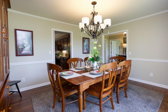 dining space featuring crown molding, baseboards, an inviting chandelier, and dark wood finished floors