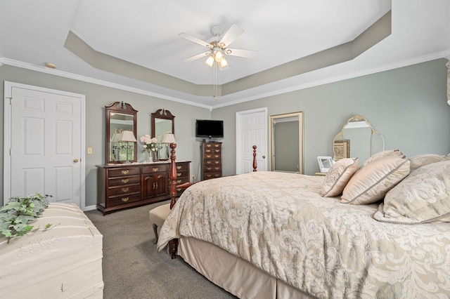 bedroom featuring carpet flooring, a ceiling fan, ornamental molding, and a raised ceiling