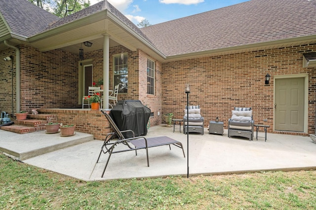 view of patio featuring a grill