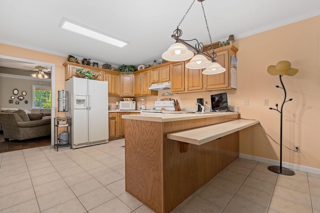 kitchen with white appliances, light countertops, a peninsula, light tile patterned floors, and under cabinet range hood