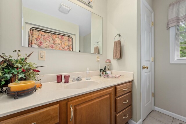 bathroom featuring vanity, tile patterned floors, and visible vents
