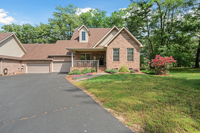craftsman house featuring a porch, brick siding, crawl space, and a garage