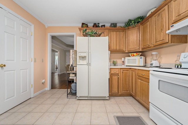 kitchen featuring crown molding, white appliances, light countertops, under cabinet range hood, and light tile patterned floors