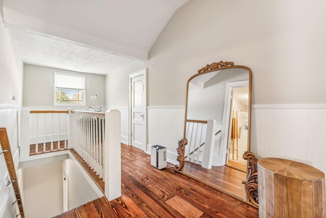 534 Greenwood Ave, Clarksville, TN 37040 - hallway with a wainscoted wall, lofted ceiling, hardwood / wood-style floors, and an upstairs landing