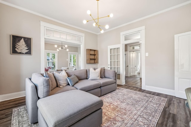 534 Greenwood Ave, Clarksville, TN 37040 - living room featuring an inviting chandelier, ornamental molding, baseboards, and dark wood finished floors