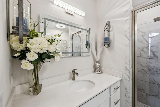 bathroom featuring vanity and a stall shower