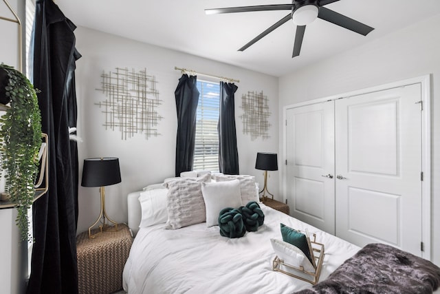 bedroom featuring ceiling fan and a closet