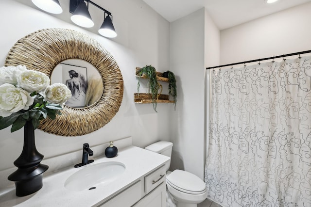 full bathroom with vanity, toilet, and a shower with shower curtain