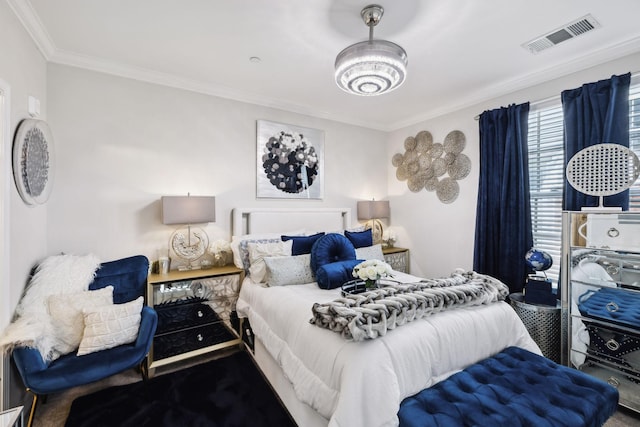 bedroom with crown molding and visible vents