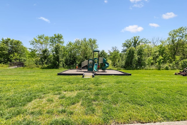 community jungle gym featuring a yard