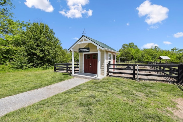 exterior space featuring fence and an outdoor structure