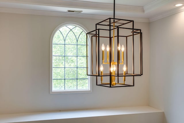 room details with an inviting chandelier, a raised ceiling, recessed lighting, visible vents, and ornamental molding
