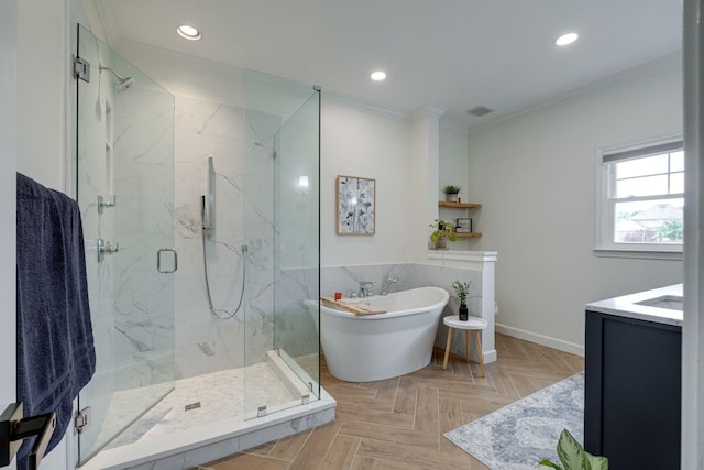 bathroom with a freestanding bath, crown molding, vanity, a marble finish shower, and recessed lighting