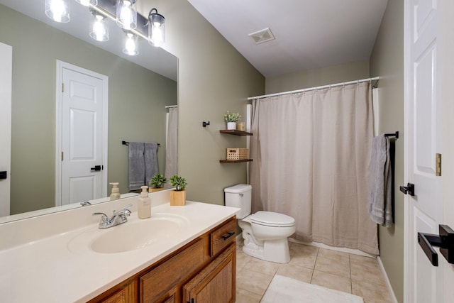 bathroom with vanity, tile patterned flooring, toilet, and visible vents