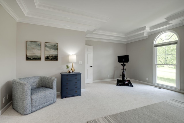 sitting room with baseboards, ornamental molding, and carpet flooring