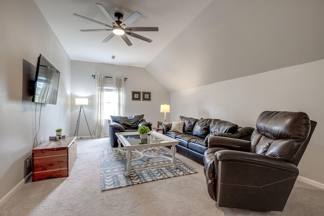 living area with carpet floors, ceiling fan, baseboards, and lofted ceiling