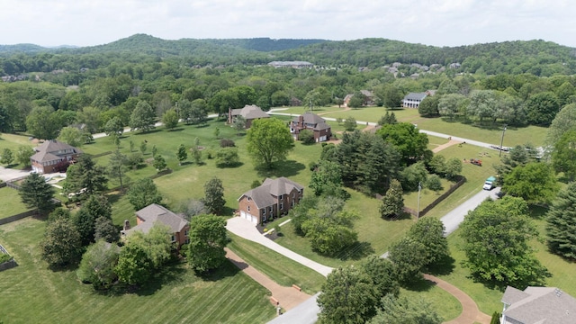 bird's eye view featuring a wooded view