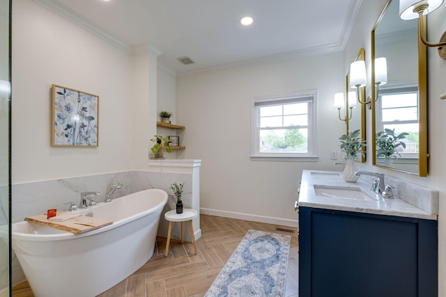 bathroom featuring vanity, ornamental molding, visible vents, recessed lighting, and a freestanding bath