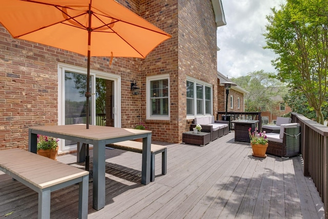 wooden deck with outdoor dining area and an outdoor living space