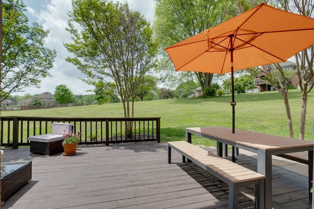 wooden terrace with a lawn