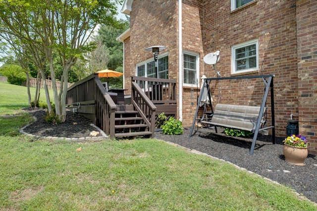 view of yard featuring a wooden deck and stairway