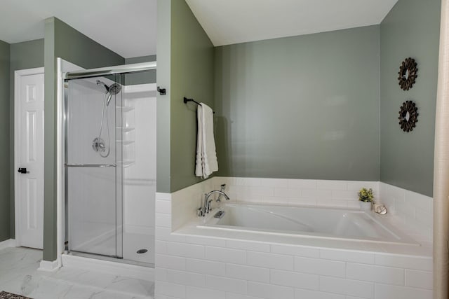 full bath with marble finish floor, a shower stall, and a bath