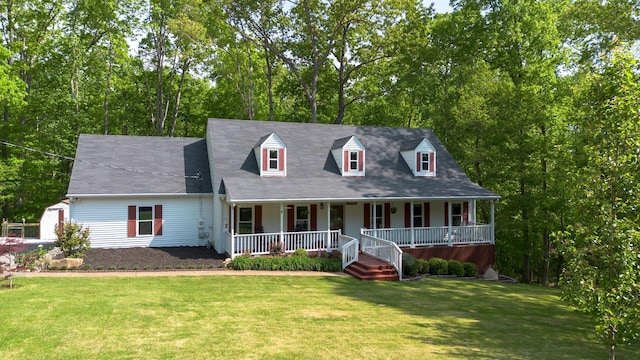 1233 Hardwood Trl, Burns, TN 37029 - cape cod house with a front lawn and covered porch