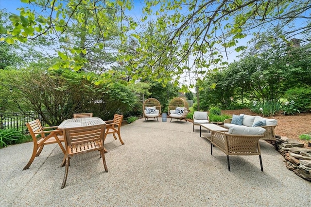 view of patio with fence and an outdoor hangout area