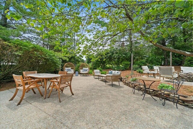 view of patio with outdoor dining area and an outdoor hangout area