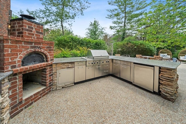 view of patio / terrace with grilling area and an outdoor kitchen