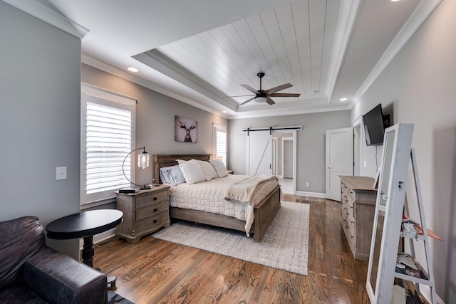 2965 Stewart Campbell Pt, Spring Hill, TN 37174 - bedroom featuring crown molding, a tray ceiling, dark wood finished floors, and a barn door