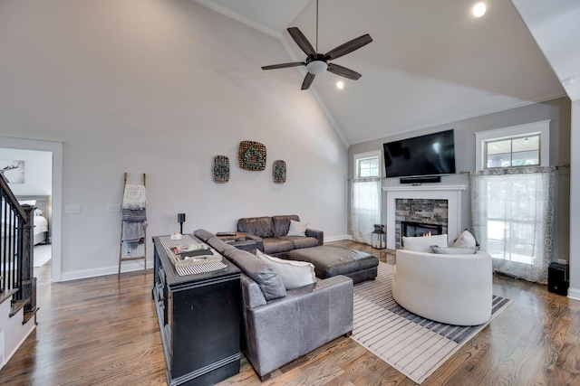 2965 Stewart Campbell Pt, Spring Hill, TN 37174 - living room with a fireplace, high vaulted ceiling, stairs, a ceiling fan, and ornamental molding