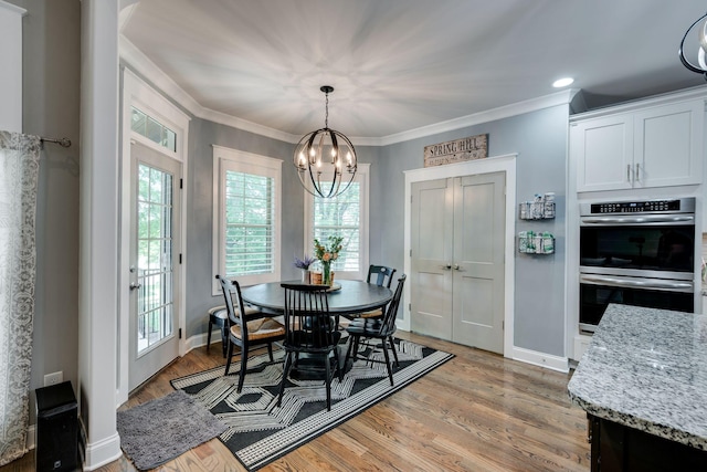 2965 Stewart Campbell Pt, Spring Hill, TN 37174 - dining space with an inviting chandelier, baseboards, plenty of natural light, and light wood-style floors
