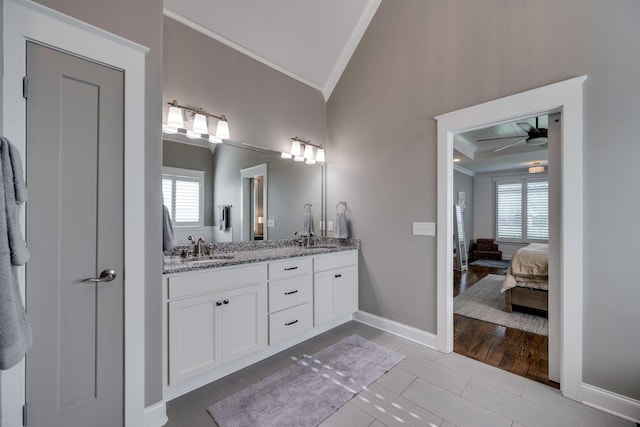 2965 Stewart Campbell Pt, Spring Hill, TN 37174 - full bathroom featuring double vanity, ornamental molding, a sink, ensuite bath, and vaulted ceiling
