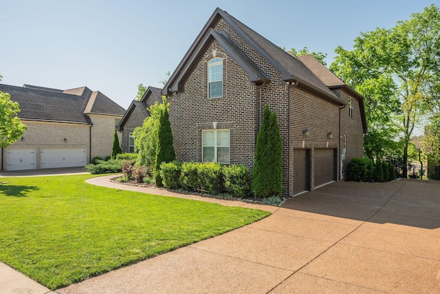 2965 Stewart Campbell Pt, Spring Hill, TN 37174 - view of home's exterior featuring a lawn, concrete driveway, a garage, and brick siding