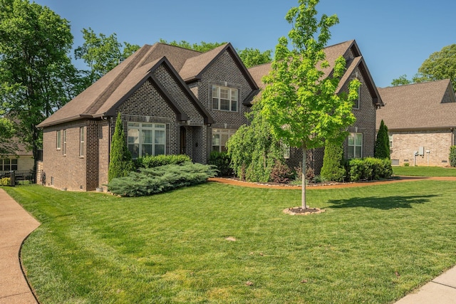 2965 Stewart Campbell Pt, Spring Hill, TN 37174 - view of front of property with brick siding, a shingled roof, and a front yard