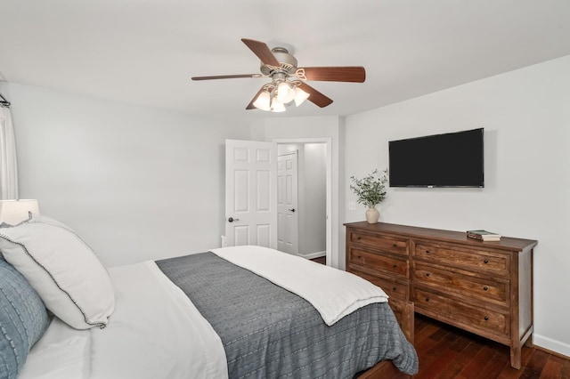bedroom featuring baseboards, ceiling fan, and hardwood / wood-style floors