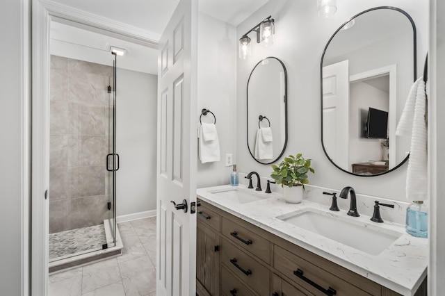 bathroom with double vanity, a sink, marble finish floor, and a shower stall
