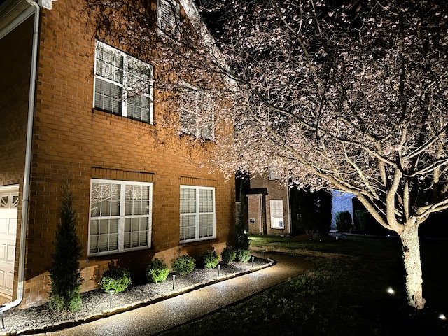 view of property exterior featuring brick siding